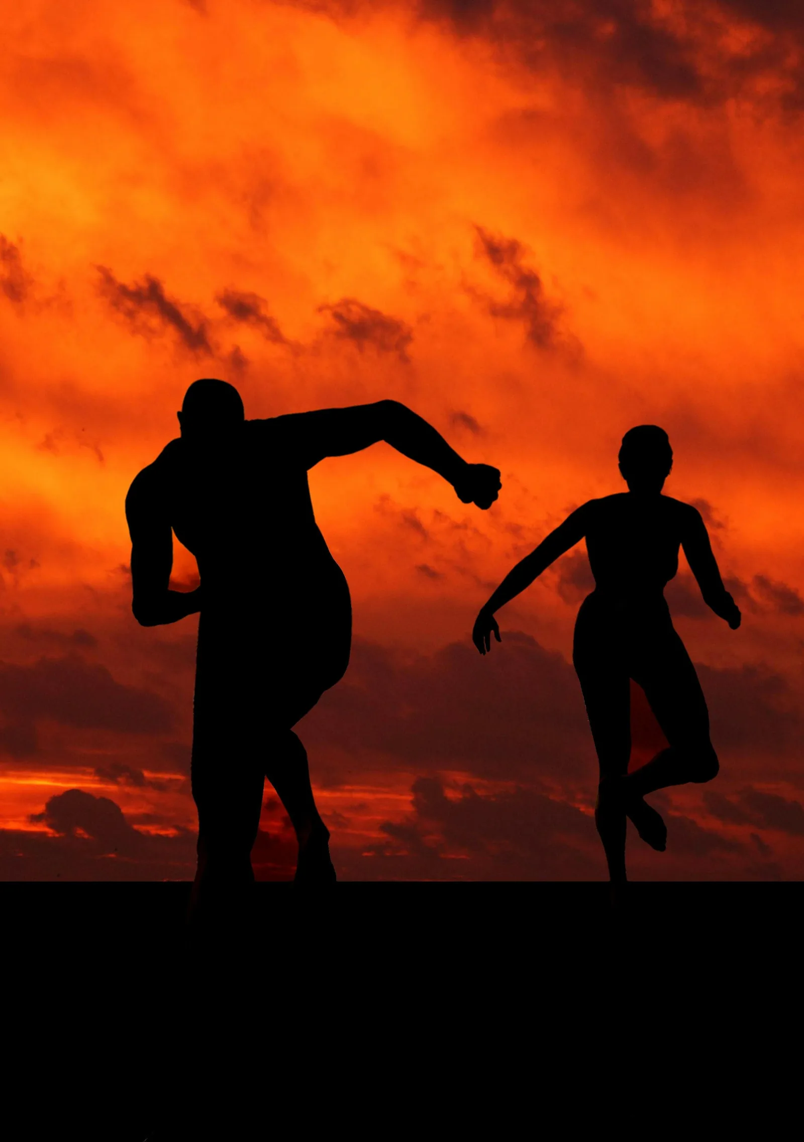 Silhouettes of two runners against an orange sunset sky